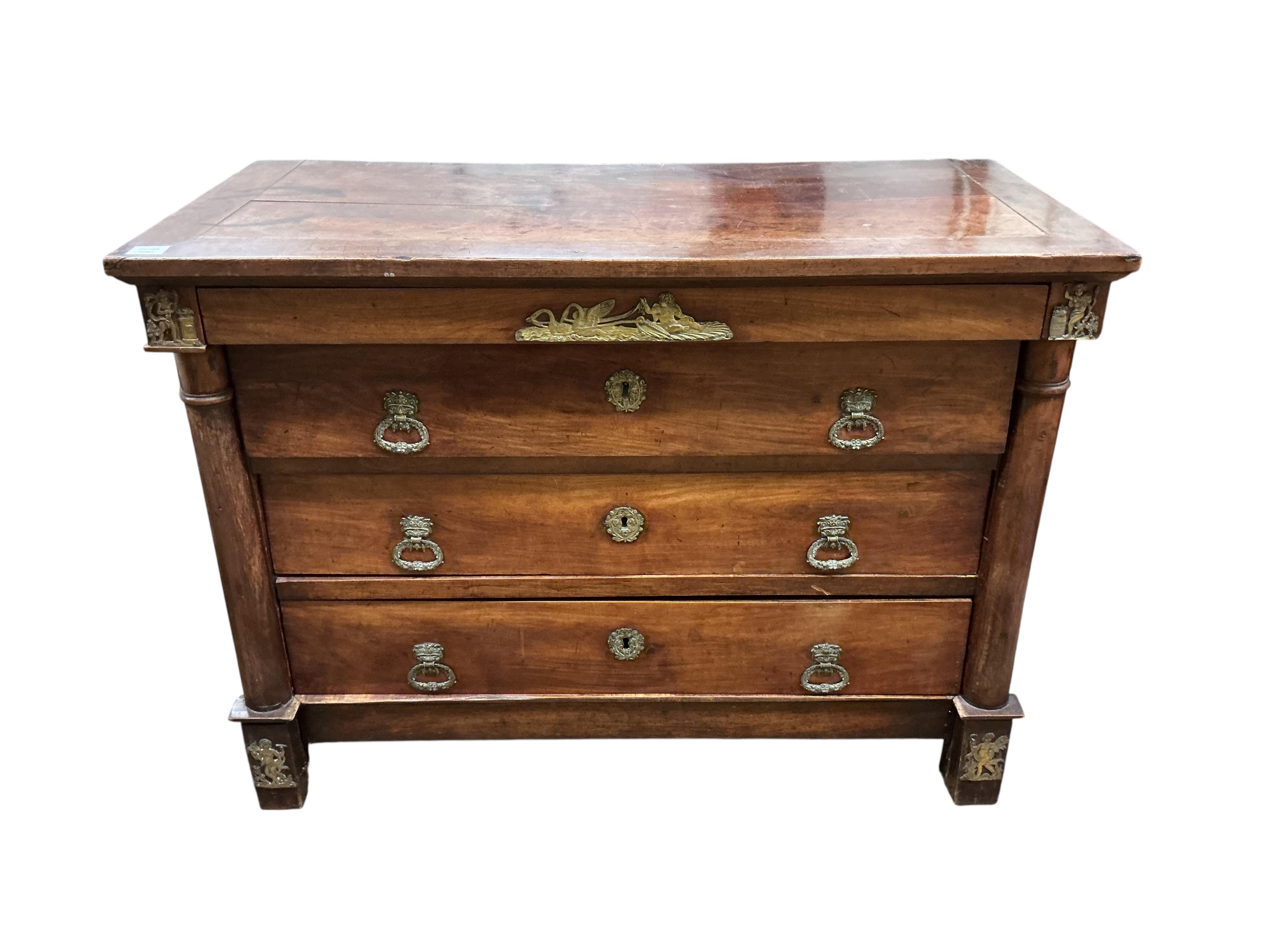An early 19th century French ormolu mounted cherry commode, fitted four long drawers, width 117cm, depth 56cm, height 87cm
